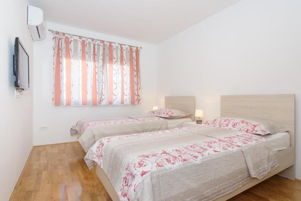 Posteľ alebo postele v izbe v ubytovaní Apartment Kate