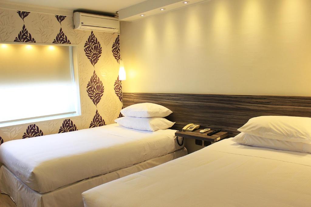 Una cama o camas en una habitación de Hotel Las Terrazas Business