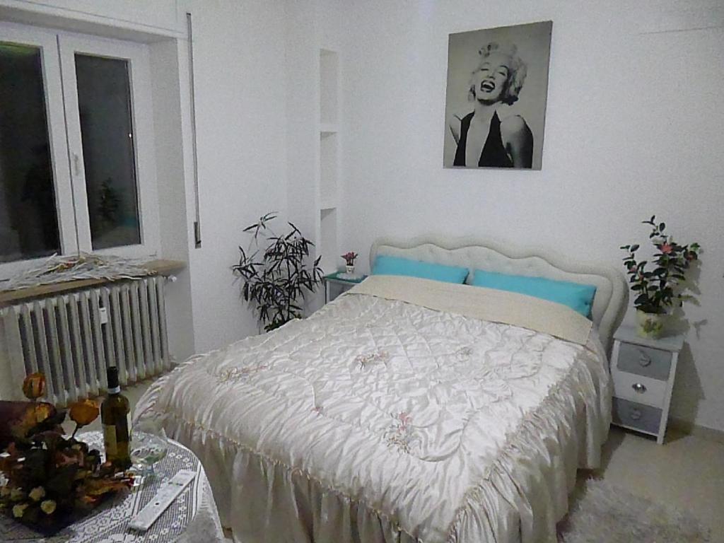 Postel nebo postele na pokoji v ubytování Monaco Rooms