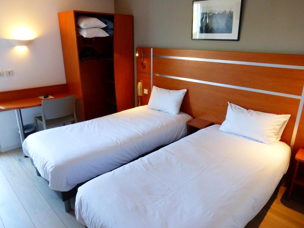 Postel nebo postele na pokoji v ubytování Hotel & Restaurant Heliotel