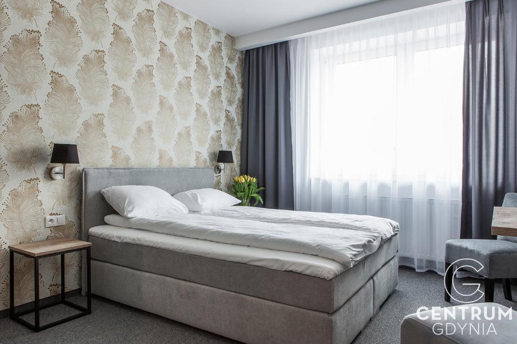 Postel nebo postele na pokoji v ubytování Gdynia Centrum
