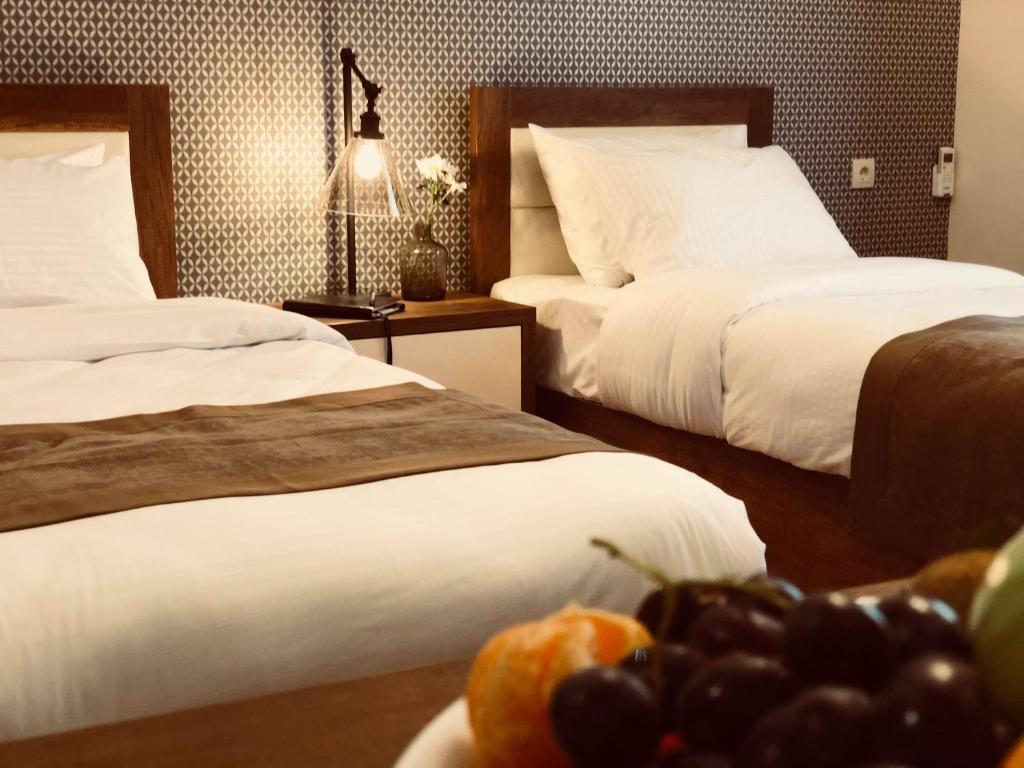 Postel nebo postele na pokoji v ubytování Hotel Amser