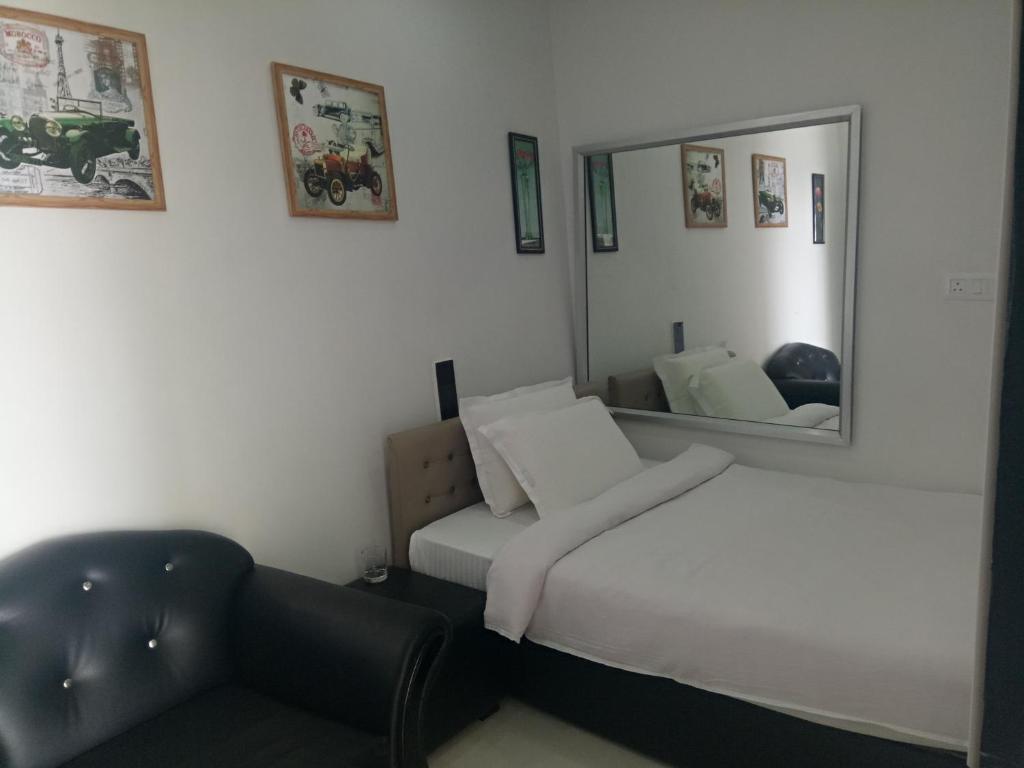 Postel nebo postele na pokoji v ubytování J. I. T HOTEL