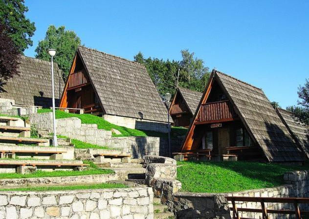 a group of buildings with grass on the roofs at Domki Brda in Karpacz