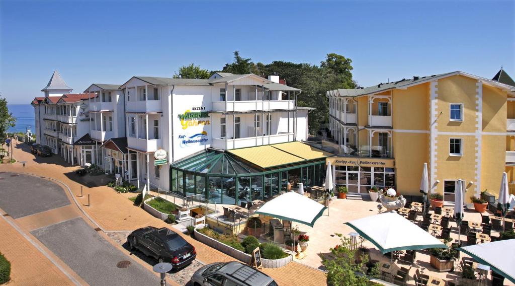 an aerial view of a building with cars parked outside at AKZENT Waldhotel Spa Rügen in Göhren