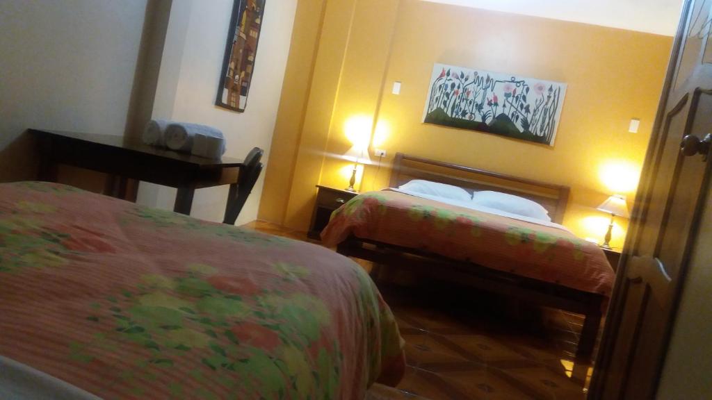 Postel nebo postele na pokoji v ubytování Hostal Timara