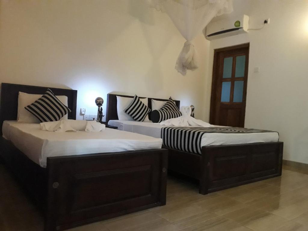 Postel nebo postele na pokoji v ubytování Isanka Lion Lodge