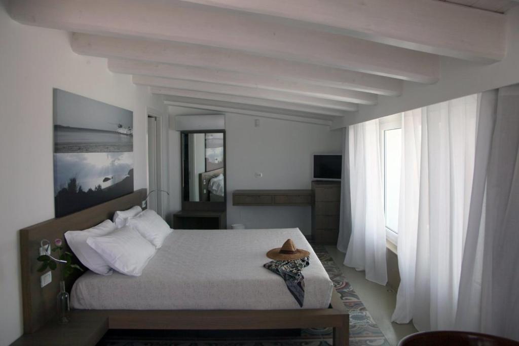 Een bed of bedden in een kamer bij Dimora Del Dragone