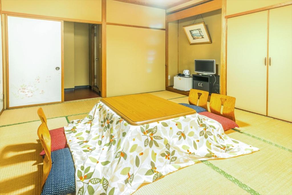 Postel nebo postele na pokoji v ubytování Hotel Ina