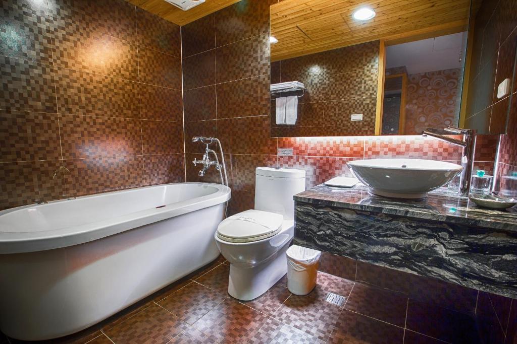 Koupelna v ubytování Cai She Hotel
