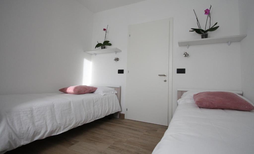 Postel nebo postele na pokoji v ubytování Casa ai Stabli