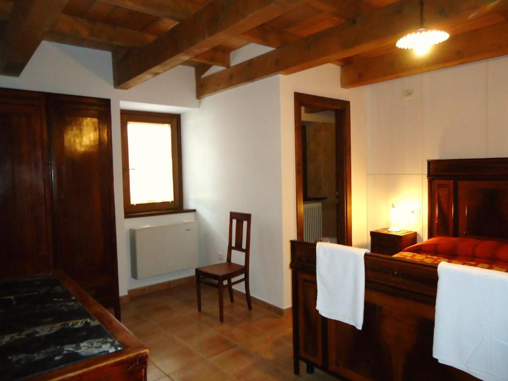 A bed or beds in a room at Villa Pascolo