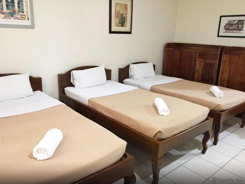 Postel nebo postele na pokoji v ubytování El Haciendero Private Hotel