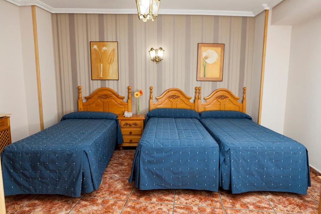 Postel nebo postele na pokoji v ubytování Hotel Guadalquivir