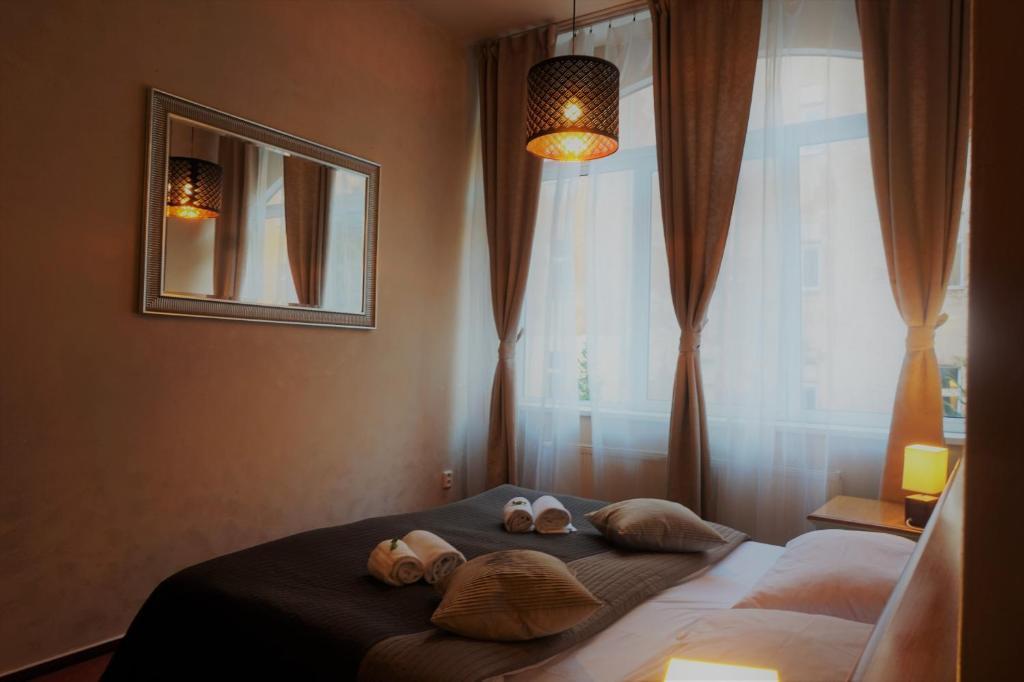 Postel nebo postele na pokoji v ubytování Hotel Augustus et Otto