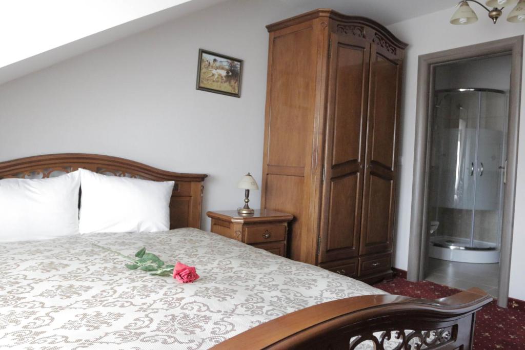 Postel nebo postele na pokoji v ubytování Hotel Slavia