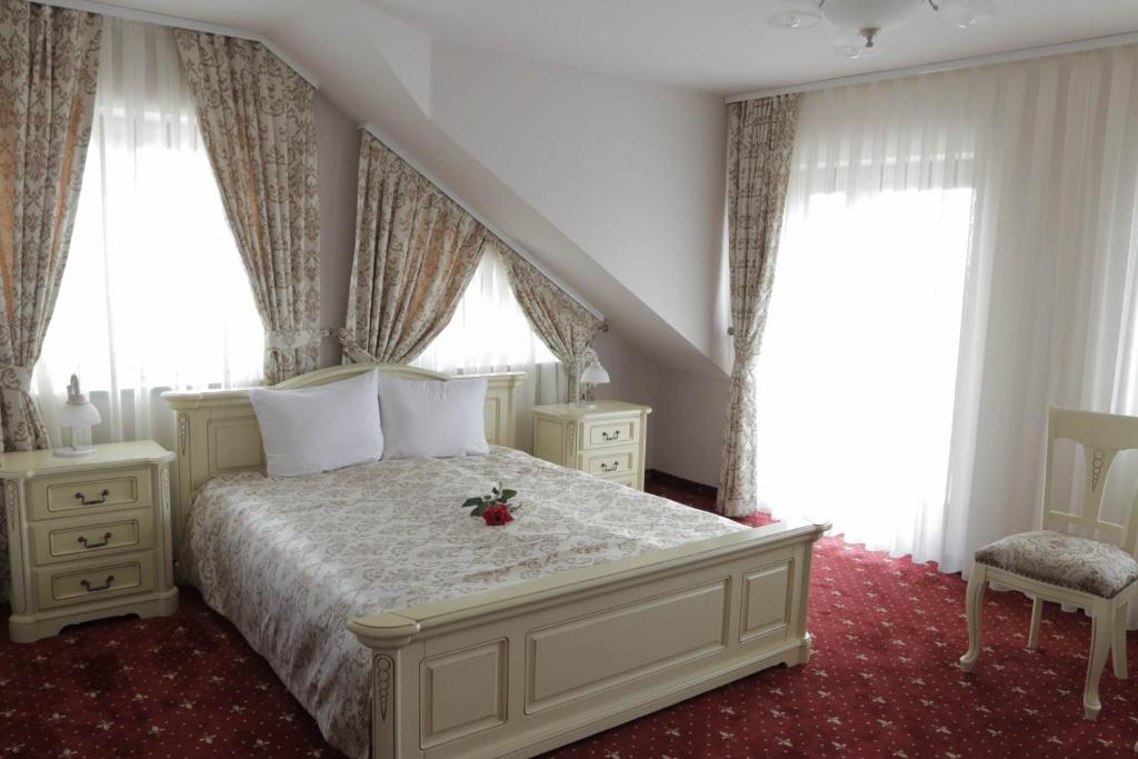 Postel nebo postele na pokoji v ubytování Hotel Slavia