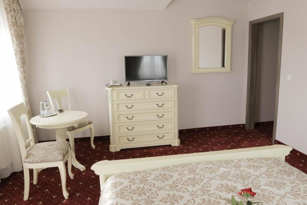 TV a/nebo společenská místnost v ubytování Hotel Slavia