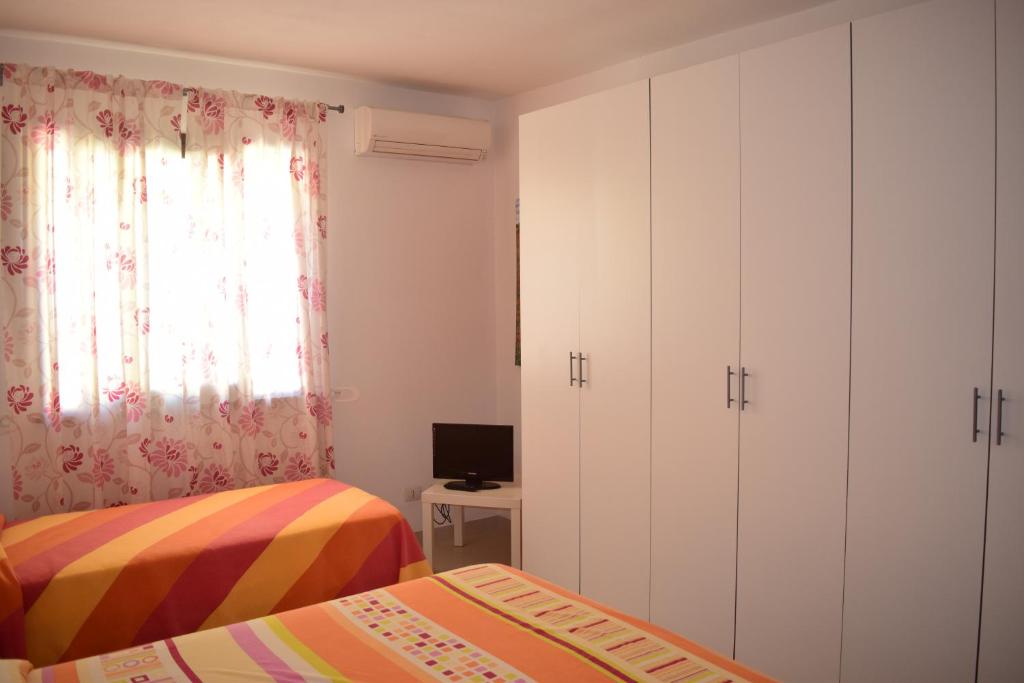 Postel nebo postele na pokoji v ubytování Vespri Siciliani