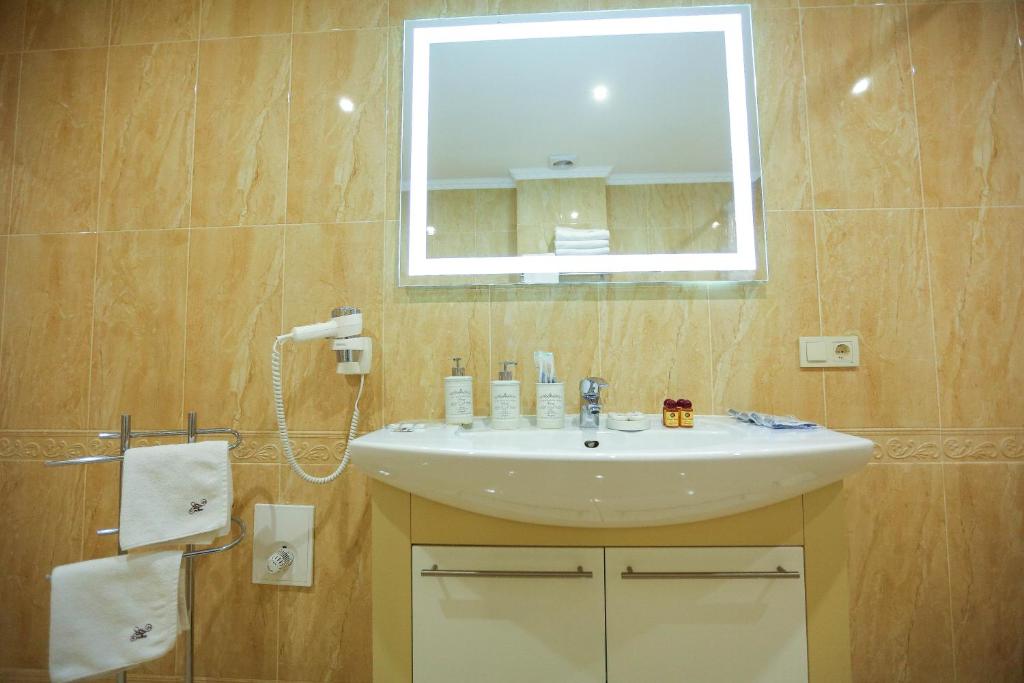 Koupelna v ubytování Home Hotel