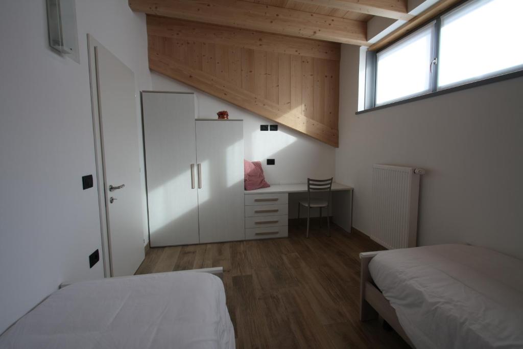 Postel nebo postele na pokoji v ubytování Casa ai Stabli