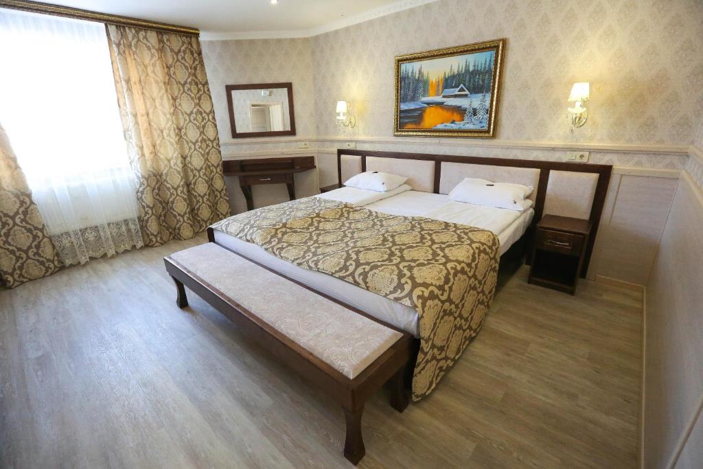 Postel nebo postele na pokoji v ubytování Home Hotel