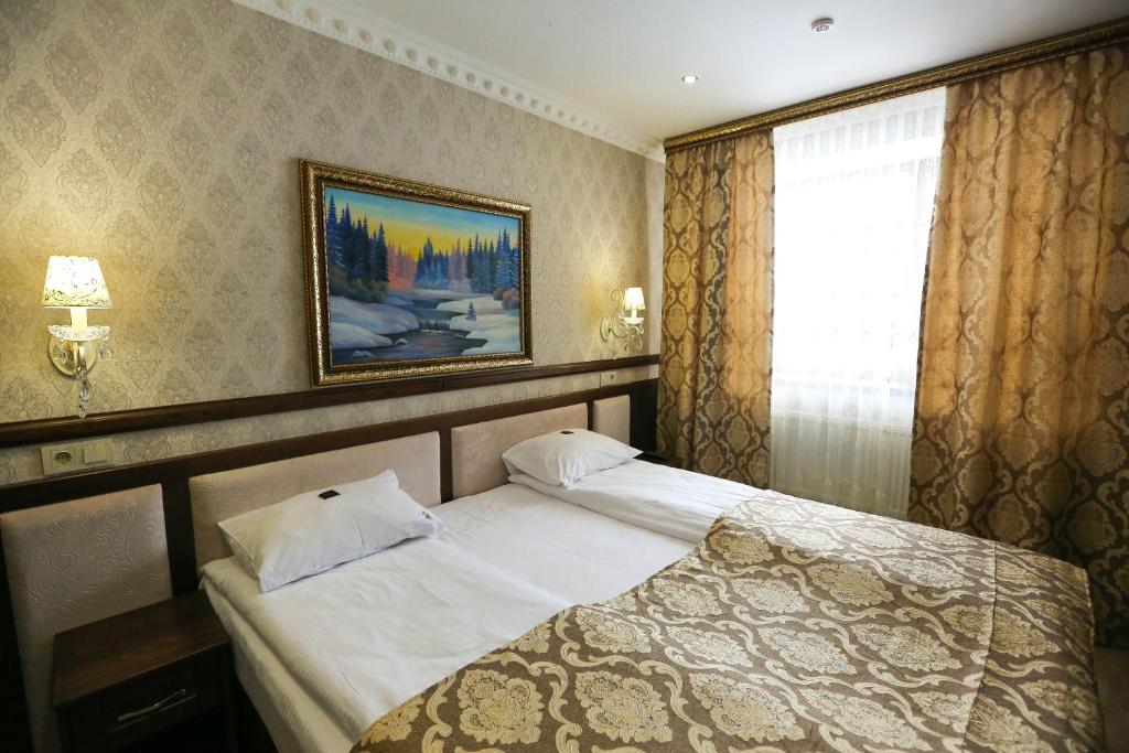 Postel nebo postele na pokoji v ubytování Home Hotel