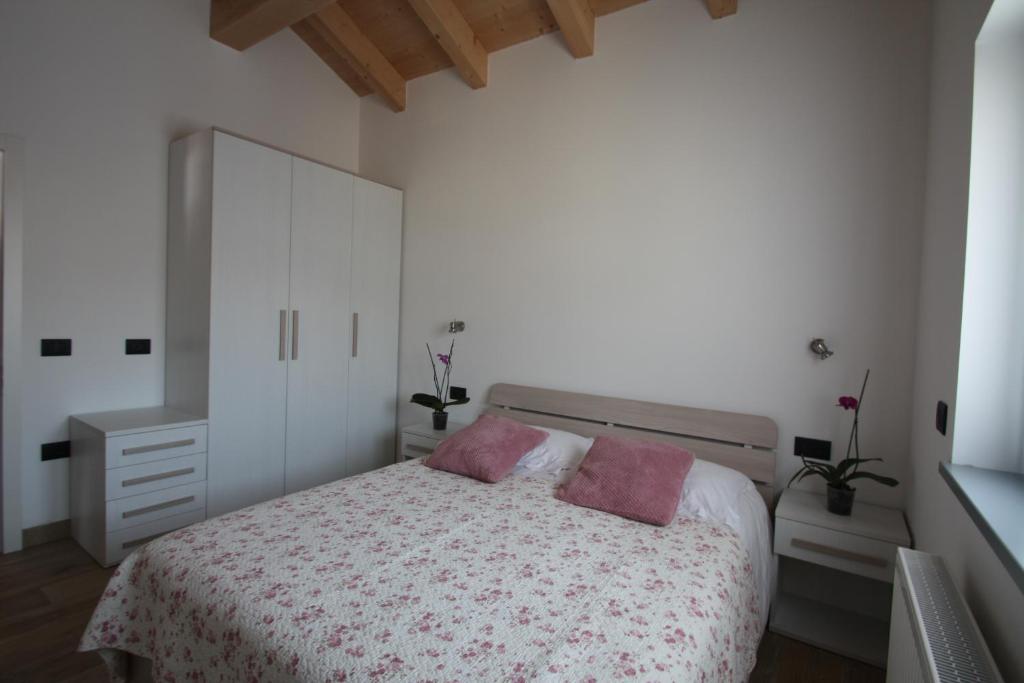 Postel nebo postele na pokoji v ubytování Casa ai Stabli