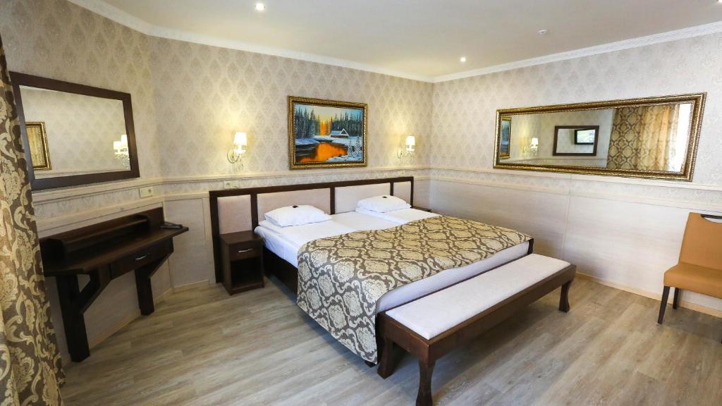 Postel nebo postele na pokoji v ubytování Home Hotel