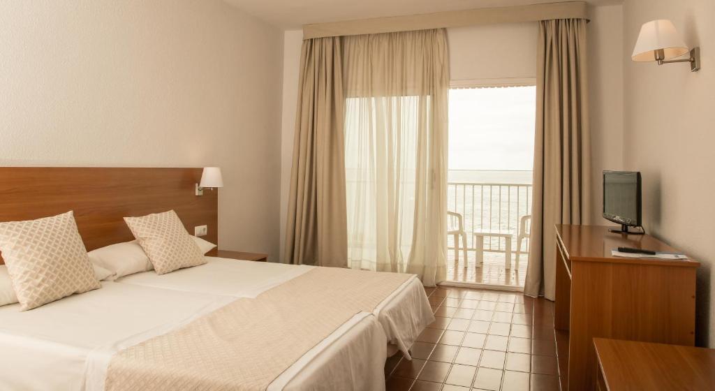 Cama o camas de una habitación en Carlos III