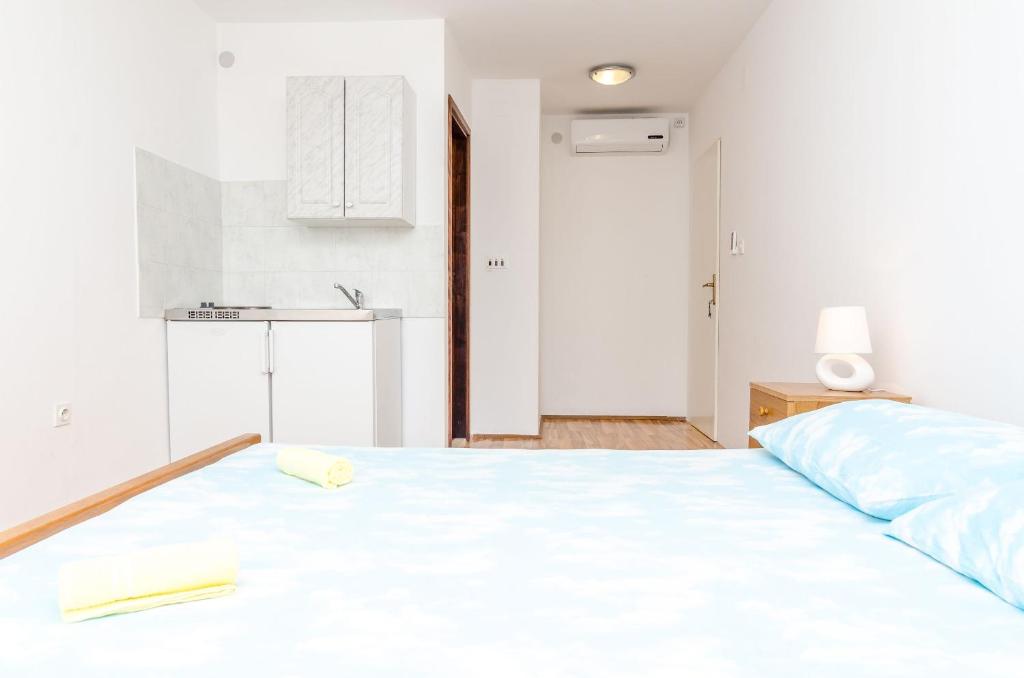 Postel nebo postele na pokoji v ubytování Guest House Kralj