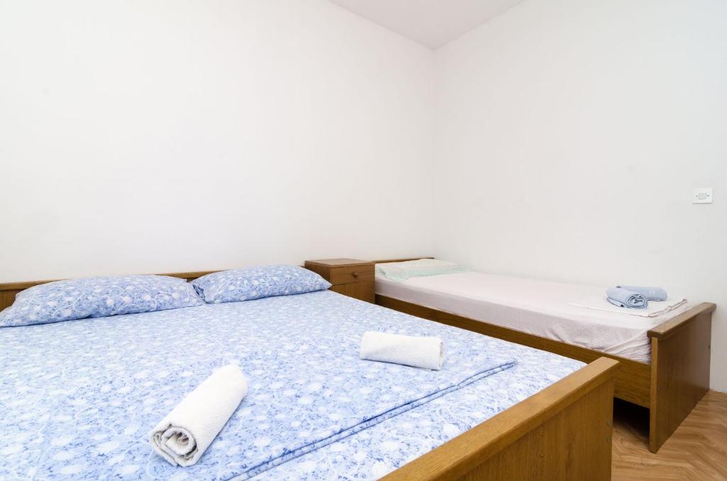 Postel nebo postele na pokoji v ubytování Guest House Kralj