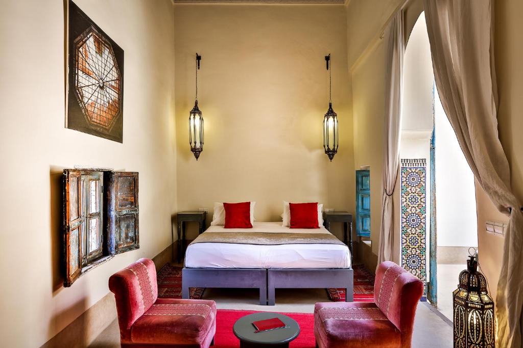 Postel nebo postele na pokoji v ubytování Hotel & Spa Dar Bensouda