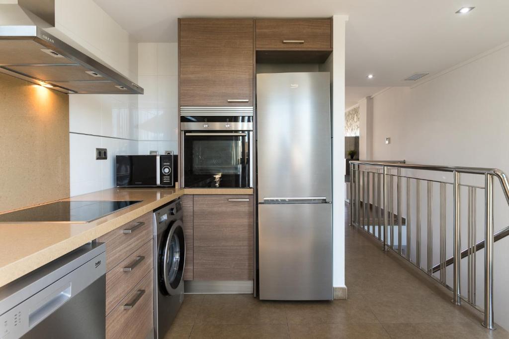 Kuchyň nebo kuchyňský kout v ubytování ApartUP Patacona Terrace Duplex I