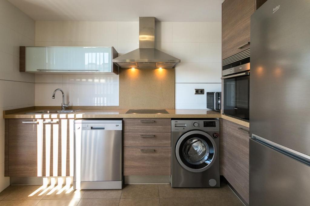 Kuchyň nebo kuchyňský kout v ubytování ApartUP Patacona Terrace Duplex I