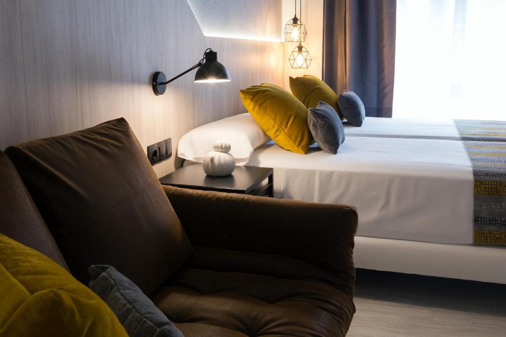 Postel nebo postele na pokoji v ubytování Hotel Onyarbi