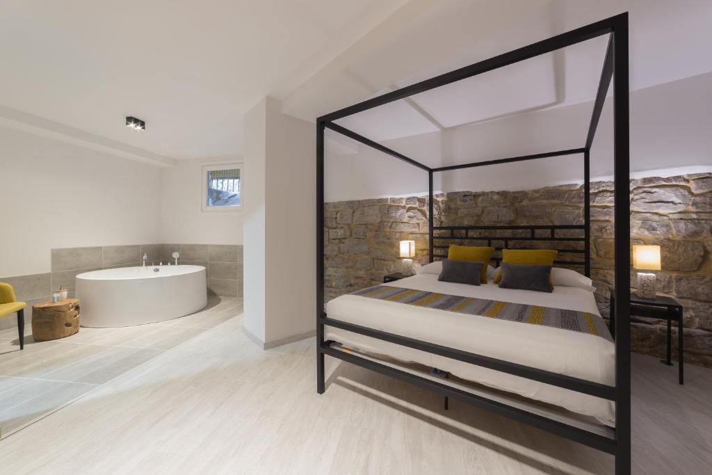 Postel nebo postele na pokoji v ubytování Hotel Onyarbi