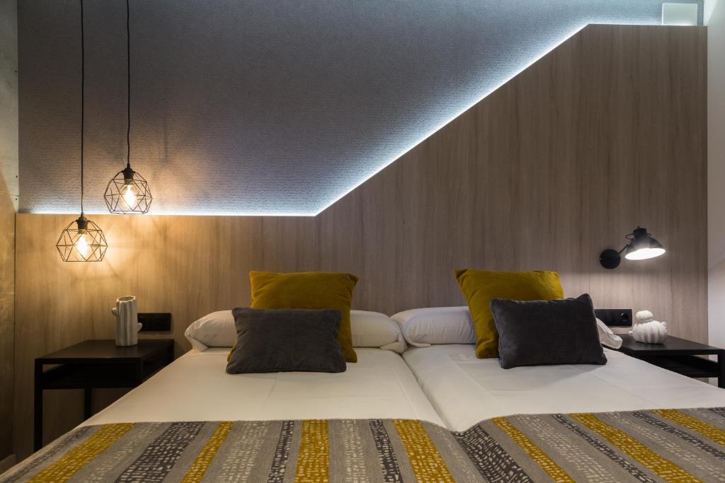 Postel nebo postele na pokoji v ubytování Hotel Onyarbi
