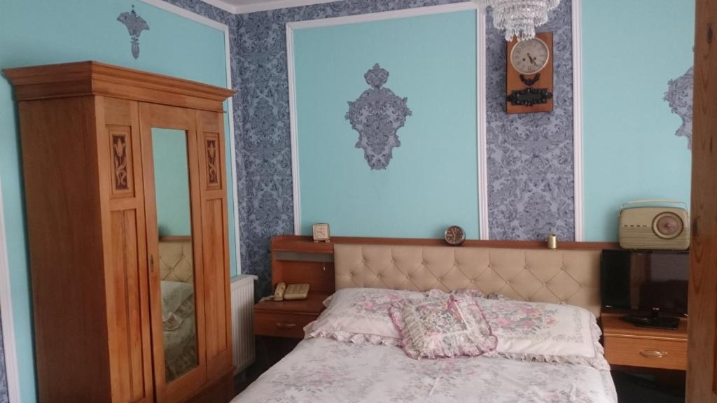 Postel nebo postele na pokoji v ubytování Willa Zamkowisko