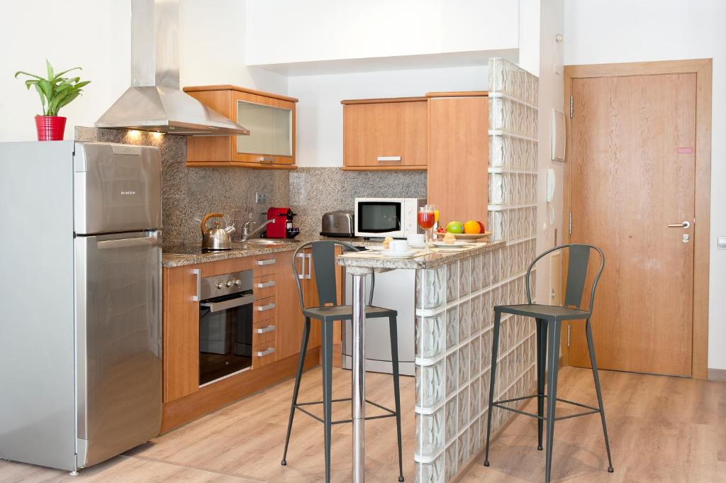 Kuchyňa alebo kuchynka v ubytovaní MH Apartments S. Familia