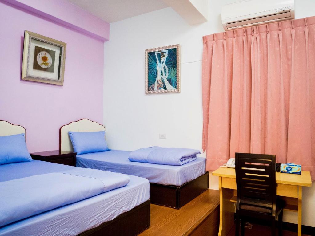 Postel nebo postele na pokoji v ubytování Jinshawan B&B