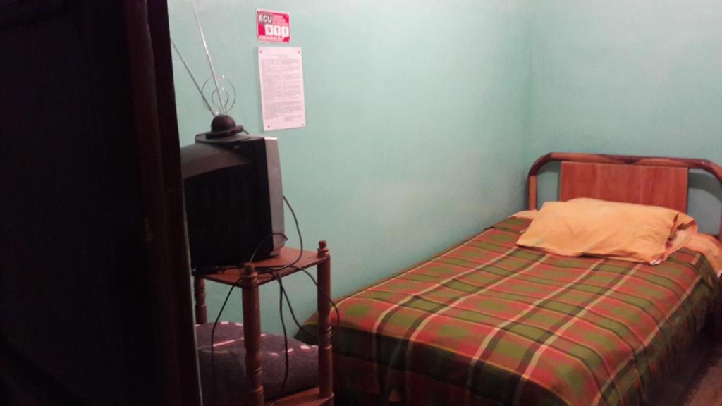 Postel nebo postele na pokoji v ubytování Hostal La Chorrera