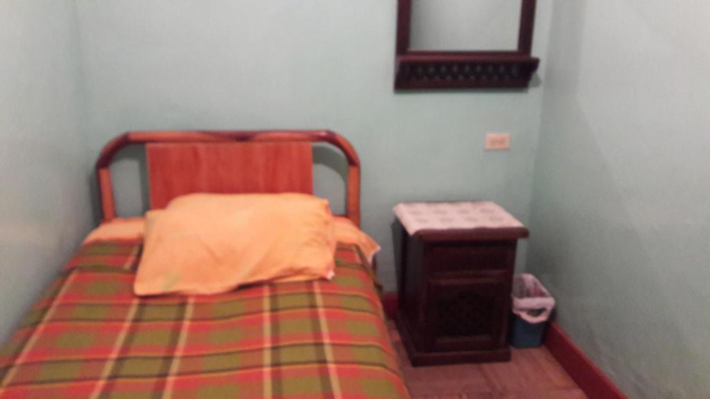 Postel nebo postele na pokoji v ubytování Hostal La Chorrera