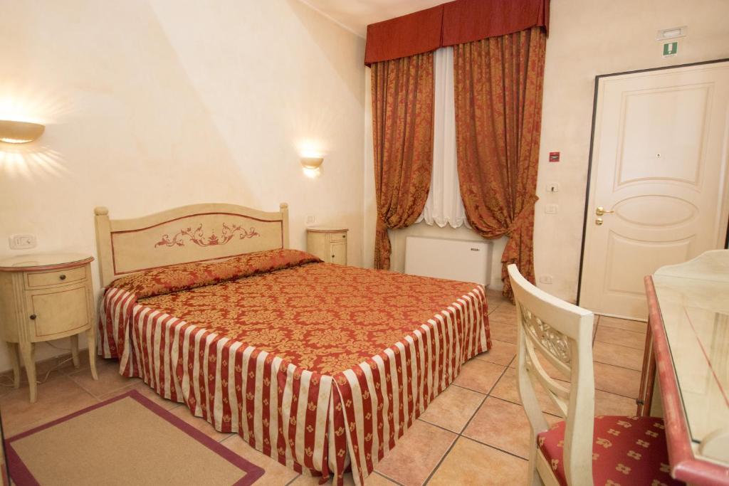 Postel nebo postele na pokoji v ubytování Hotel Adda
