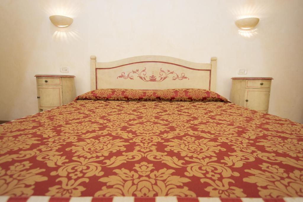 Postel nebo postele na pokoji v ubytování Hotel Adda
