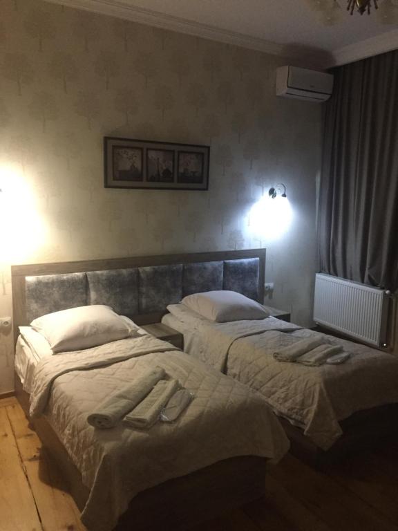 Postel nebo postele na pokoji v ubytování Guest House Rafael