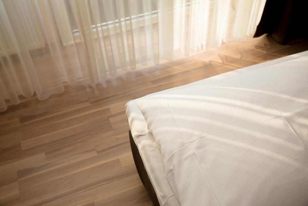 Postel nebo postele na pokoji v ubytování Hotel Drei Kronen