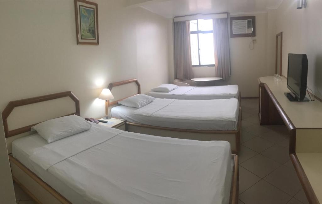 Uma cama ou camas num quarto em Hotel Grão Para