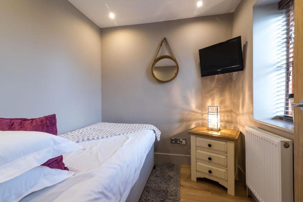 Postel nebo postele na pokoji v ubytování Briarfields Hotel