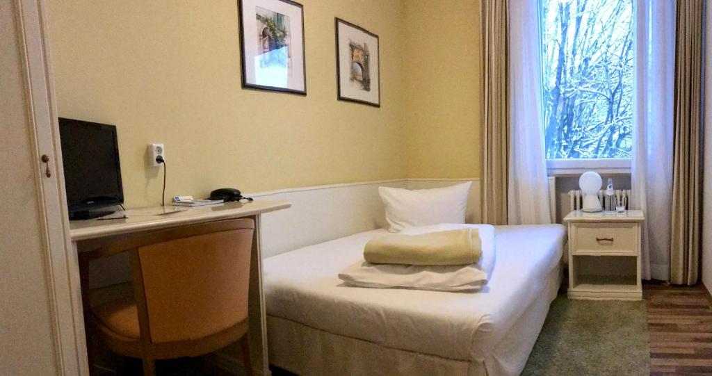 Postel nebo postele na pokoji v ubytování Hotel Schlee
